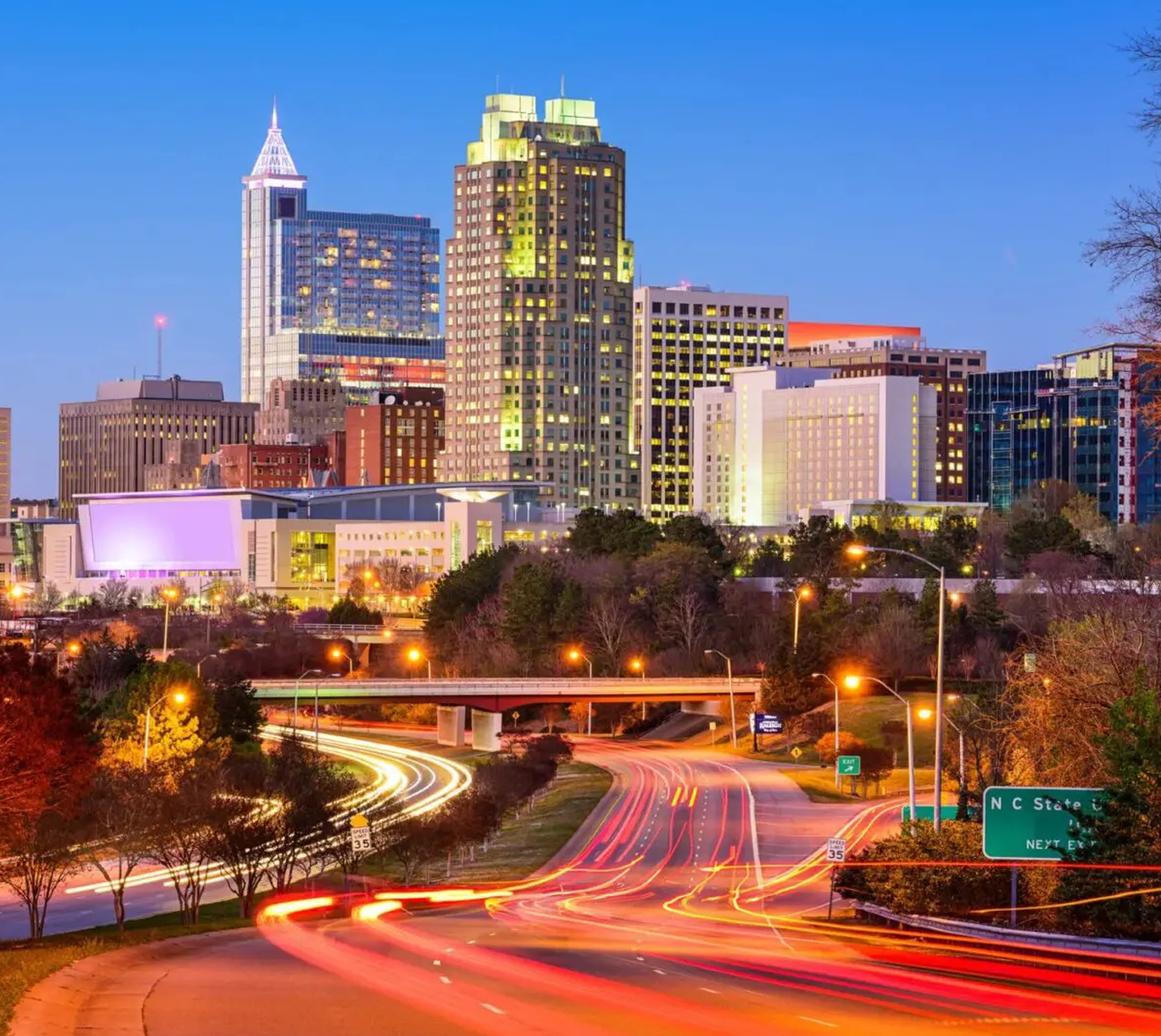 A city skyline with many buildings and lights